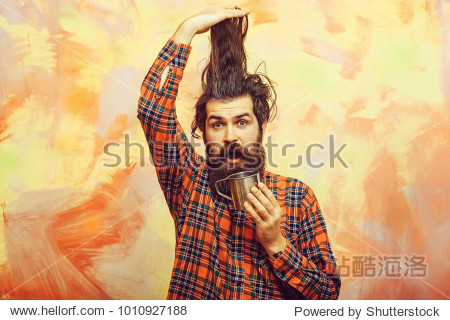 stylish fringe hair haircut and metal mug or cup in red plaid