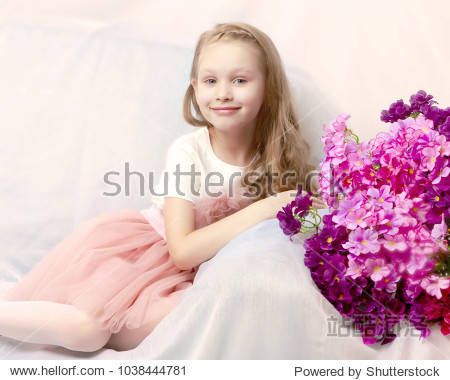 caucasian little girl with long blond hair in a beautiful pink