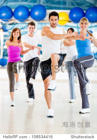 group of people in an aerobics class at the gym