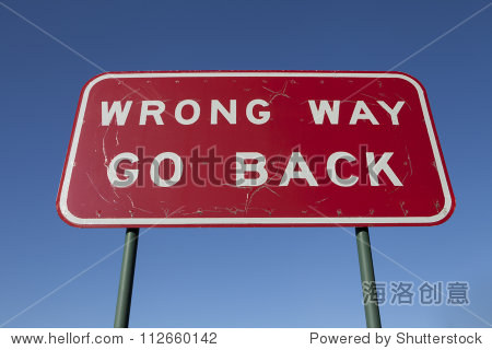 wrong way go back road sign.
