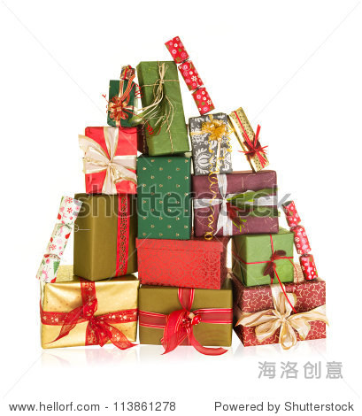 big stack of christmas presents in the shape of a