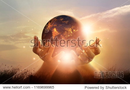 Earth at night was holding in human hands. Earth day. Energy saving concept Elements of this image furnished by NASA