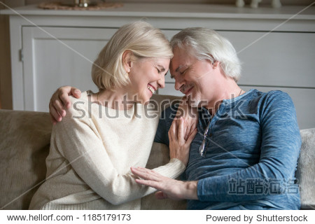 happy loving mature middle aged romantic couple laughing