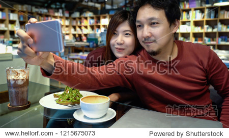 taking the selfie with happiness action in modern coffee shop or