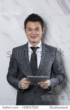 chinese man with a tablet computer.