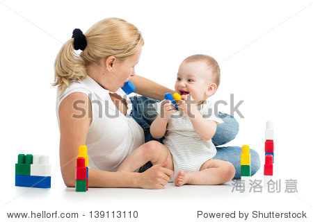 baby boy and mother playing together with construction set toy