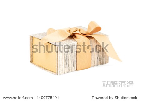 gift box of gold color with bow on top isolated on white back