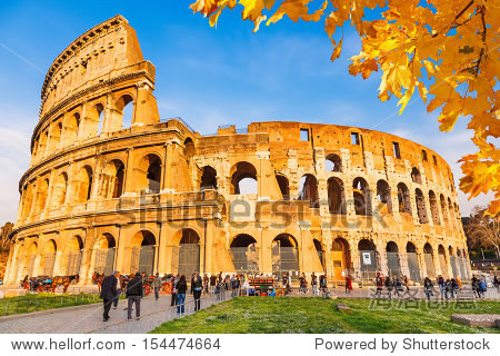 colosseum with autumn leaves, rome, italy