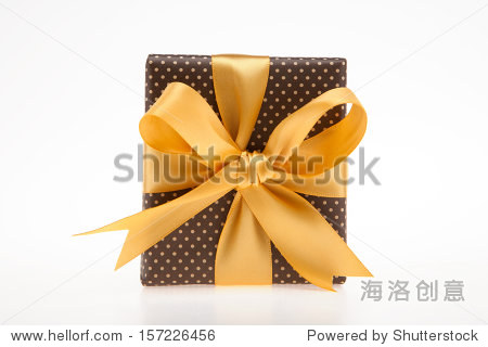 brown gift box with dots with golden ribbon top view