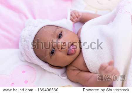 adorable little african american baby girl looking - black