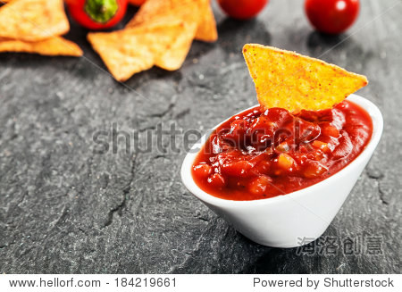 serving of hot spicy salsa sauce made with tomato