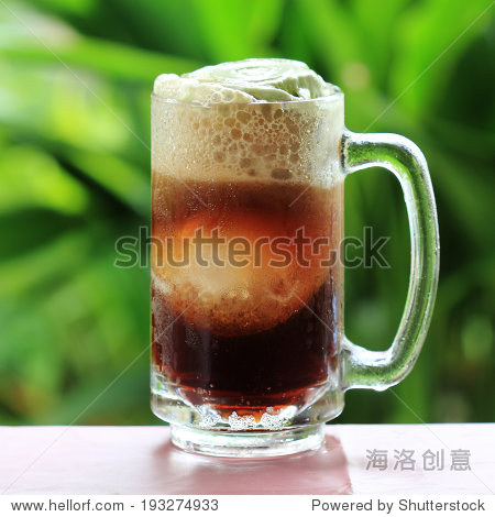 root beer float a tasty summer treat on green tree background