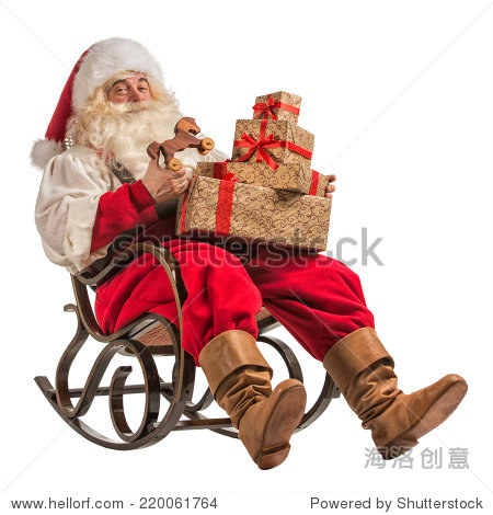 santa claus sitting in rocking chair with gifts isolated on