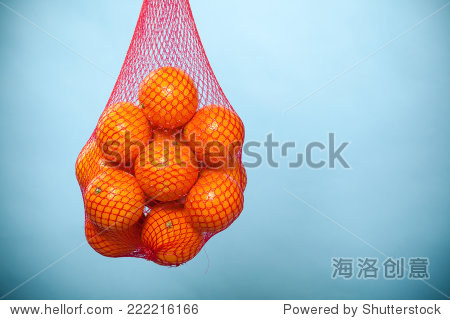 mesh bag of fresh oranges healthy tropical fruits from