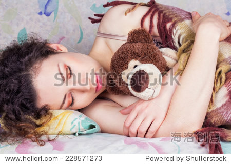 beautiful girl sleeping soundly with curly black