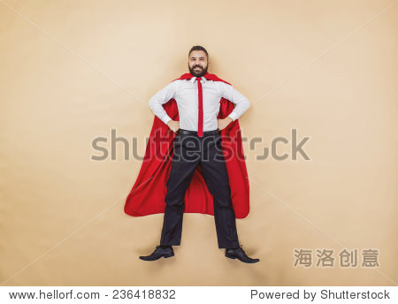 manager wearing a red superman cloak. studio shot