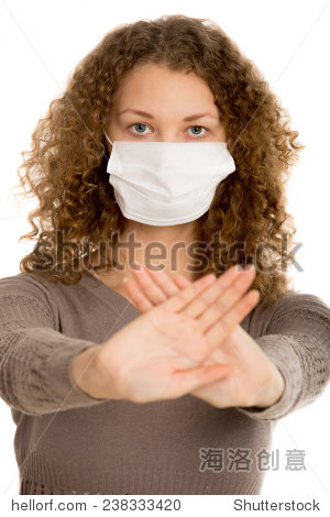 girl in face mask stretch out palms in warning