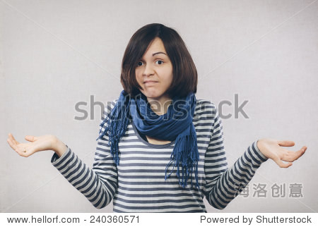 woman shrugging helpless with her shoulders