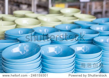 a lot of colorful bowls in a shop