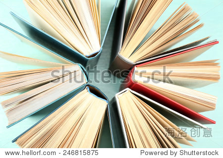 group of books on colorful background, top view