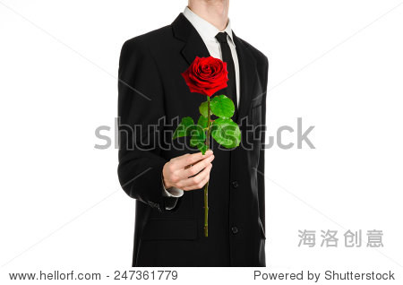 hand in a suit holding a red rose isolated on white background