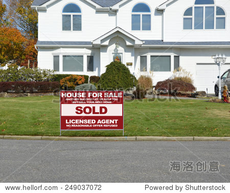 your next home) sign closeup of suburban mcmansion autumn day