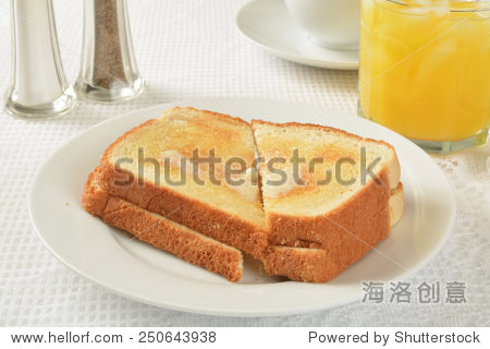 hot buttered toast with a glass of orange juice
