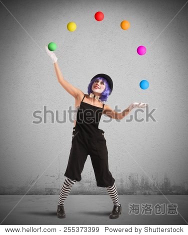 clown playing with balls like a juggler