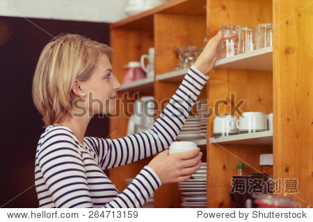 side view of a pretty young woman with short blond hair