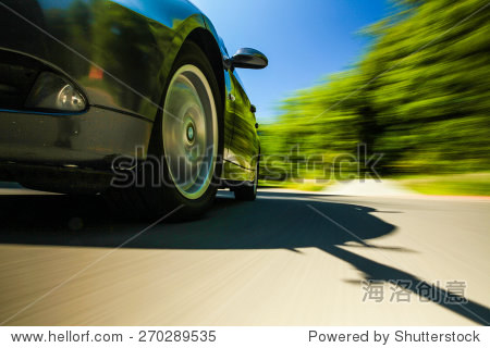 front view of speeding car.