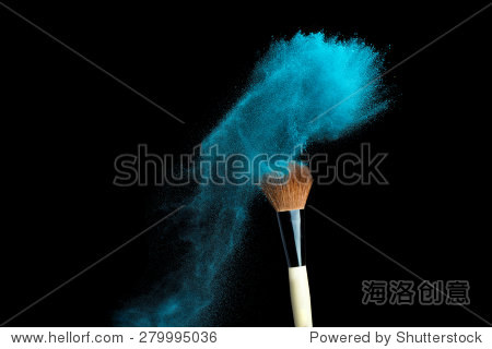 powderbrush on black background with blue powder
