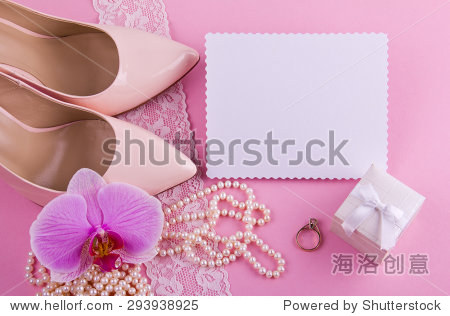 with high heel greeting card and accessories on pink background
