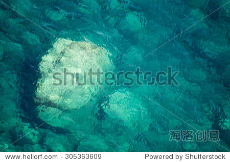 top view of beautiful rocks and the shallow turquoise water of