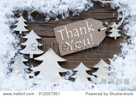 label with ribbon on wooden background with white christmas