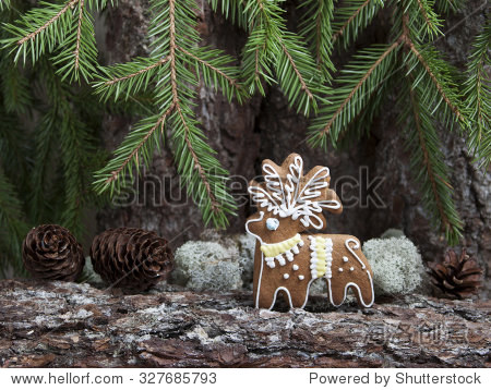 christmas gingerbread in the form of a deer on a background of