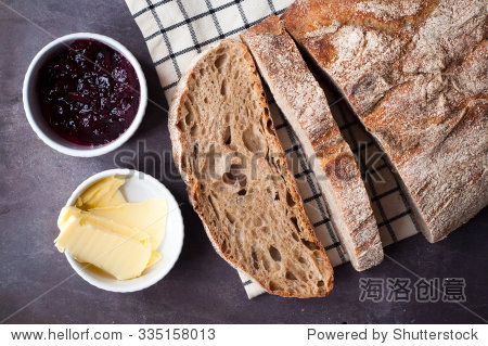 freshly baked sour dough rye bread sliced and served with jam