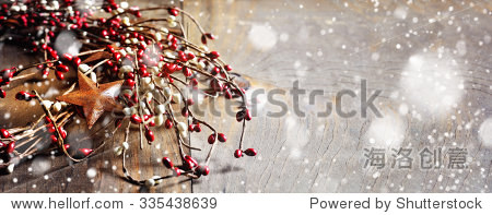 christmas wreath with berries and rusty stars on