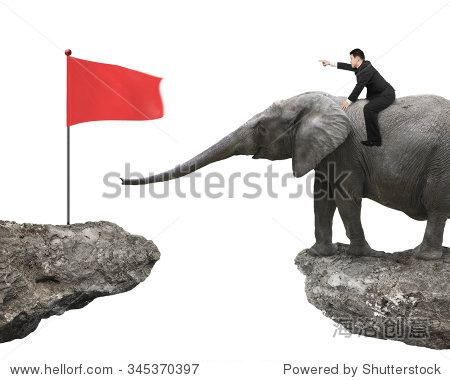 riding elephant toward red flag on cliff  isolated on white back