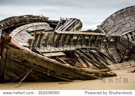 wooden derelict ship wreck on the sandy beach at boat cemetery