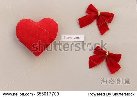 red bow with ribbon and heart - i love you concept