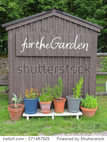 painted on the side with a row of flowerpots and plants in the