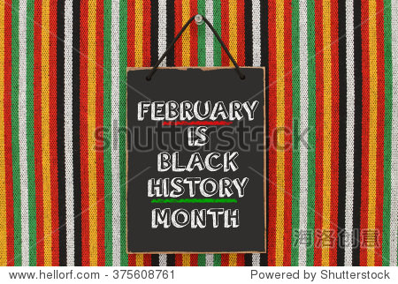 black history month blackboard hanging on striped