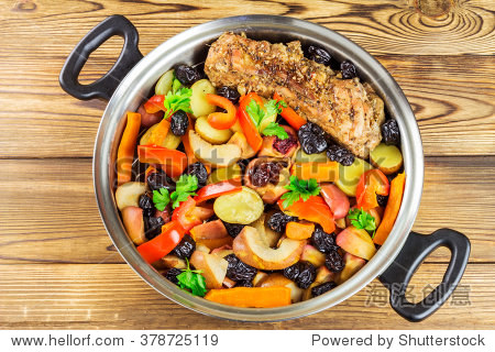 healthy food stewed pork meat with various colorful vegetables