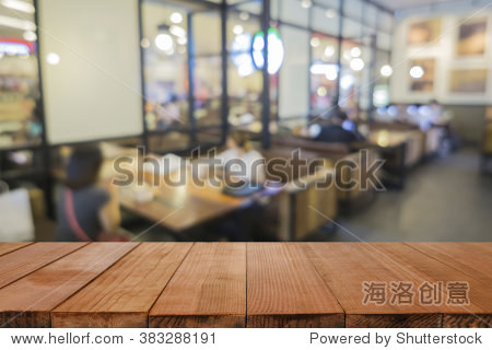 empty brown wooden table and coffee shop interior with some