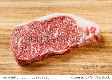 close up wagyu beef striploin steak on cutting board
