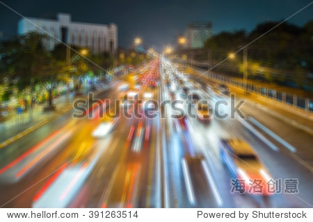 abstract image of motion blurred traffic lights at night with