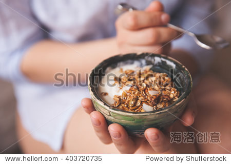 young woman with muesli bowl.