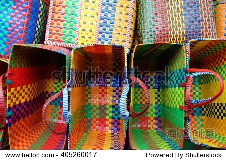 beautiful colorful handmade baskets on a display of a street