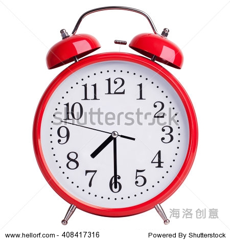 red round alarm clock shows half past seven
