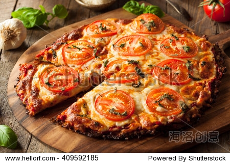 homemade vegan cauliflower crust pizza with tomato and basil